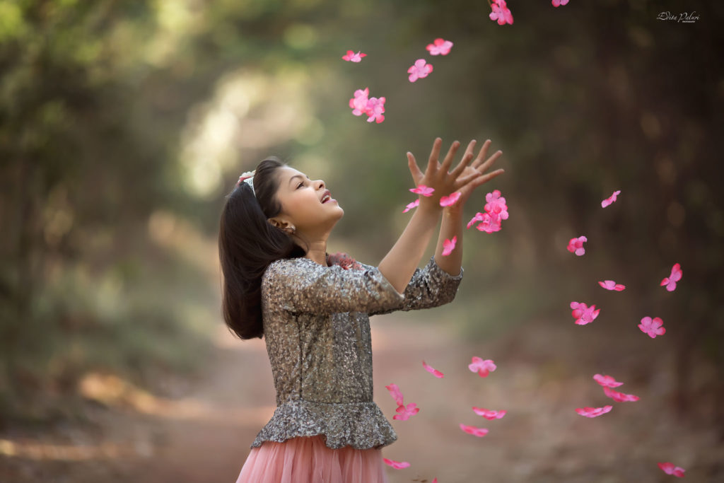 Girl is catching petals